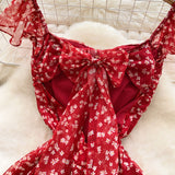 French Sweet Design With A Knotted Bow Tie With Bare Back To The Waist Of A Floral Dress